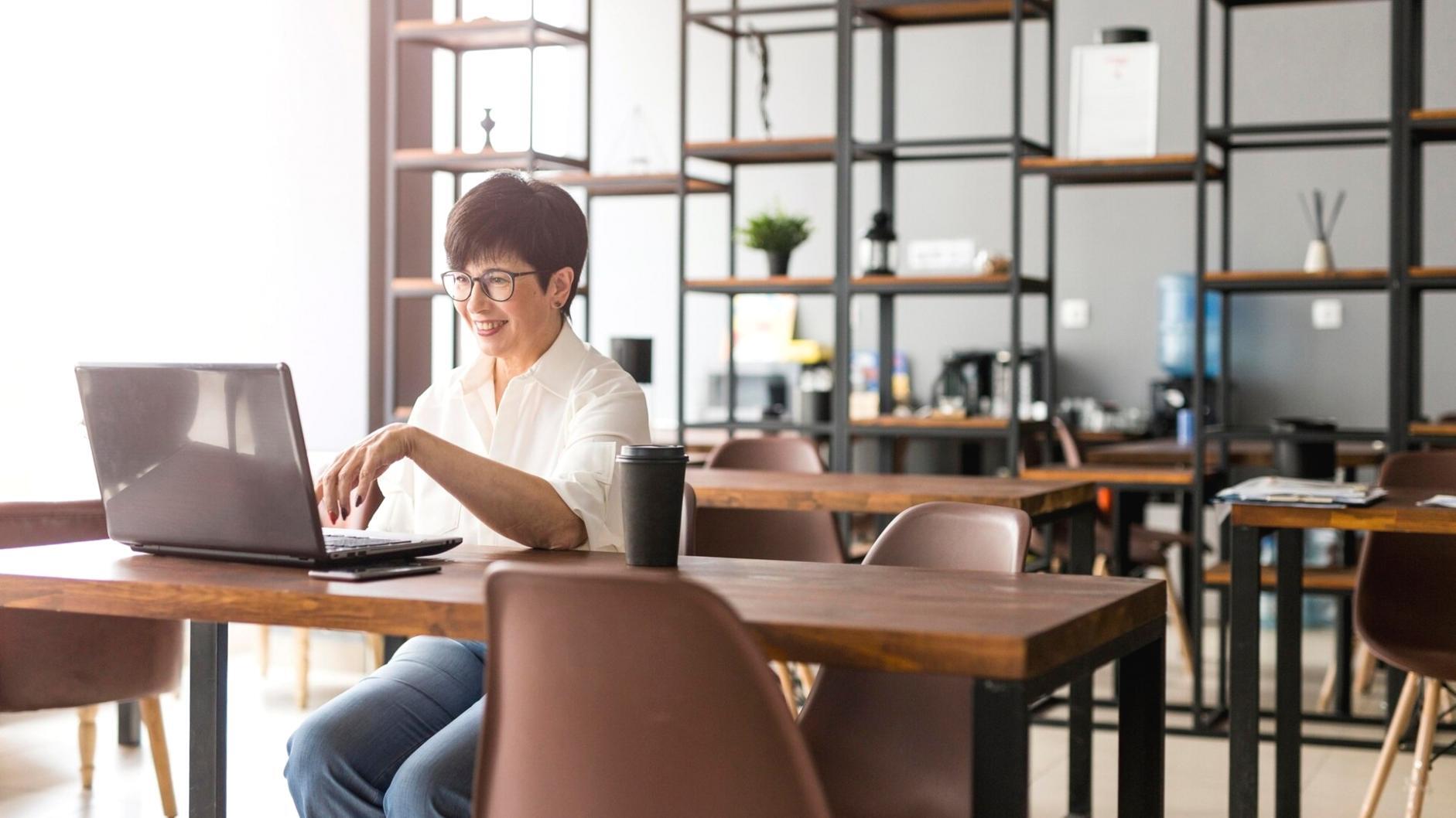 Modern financial planning workspace with digital tools and strategic documents
